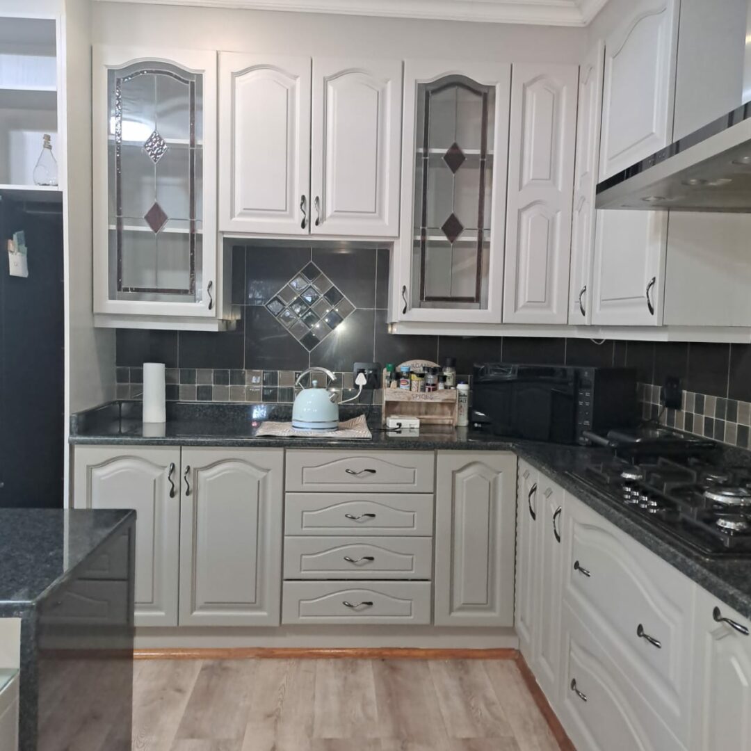 Refinished kitchen cabinets – Revive Artistry spray painting service